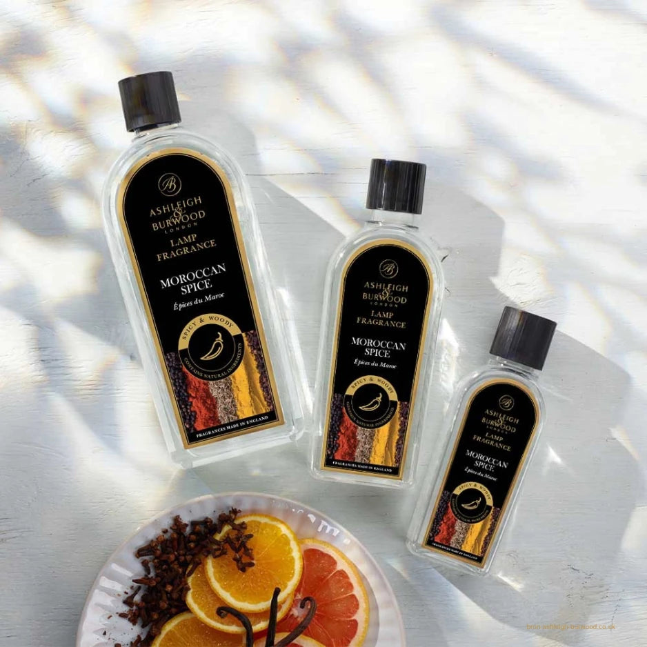 Ashleigh & Burwood Moroccan Spice fragrance oils in three bottle sizes with spices and citrus decor.